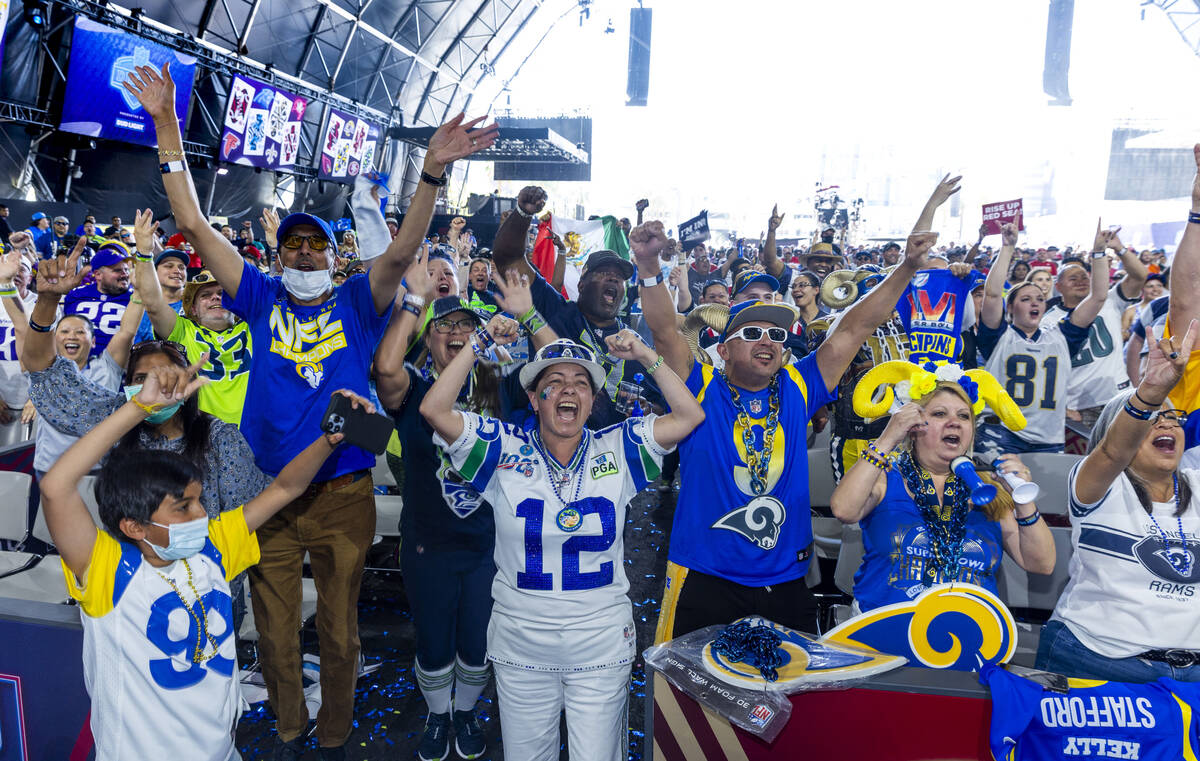 Fans cheer for their teams in the Draft Theatre during the third day selections for the 2022 NF ...