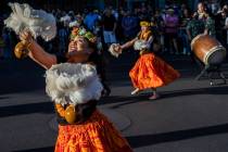 Kalei Gonzales, left, dances during Lei Day, a new parade to celebrate and kick off Asian Pacif ...
