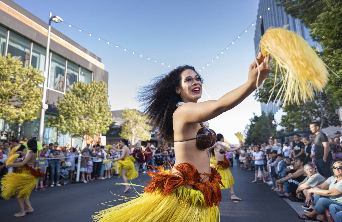 Taua Manuma, right, with Hot Lava Productions, dances during Lei Day, a new parade to celebrate ...