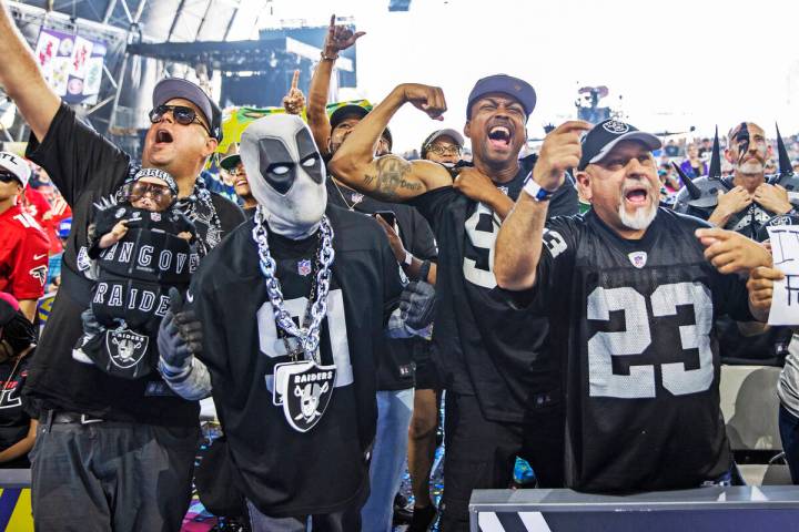 Raiders fans celebrate after Las Vegas made a draft pick during day three of the NFL draft on S ...