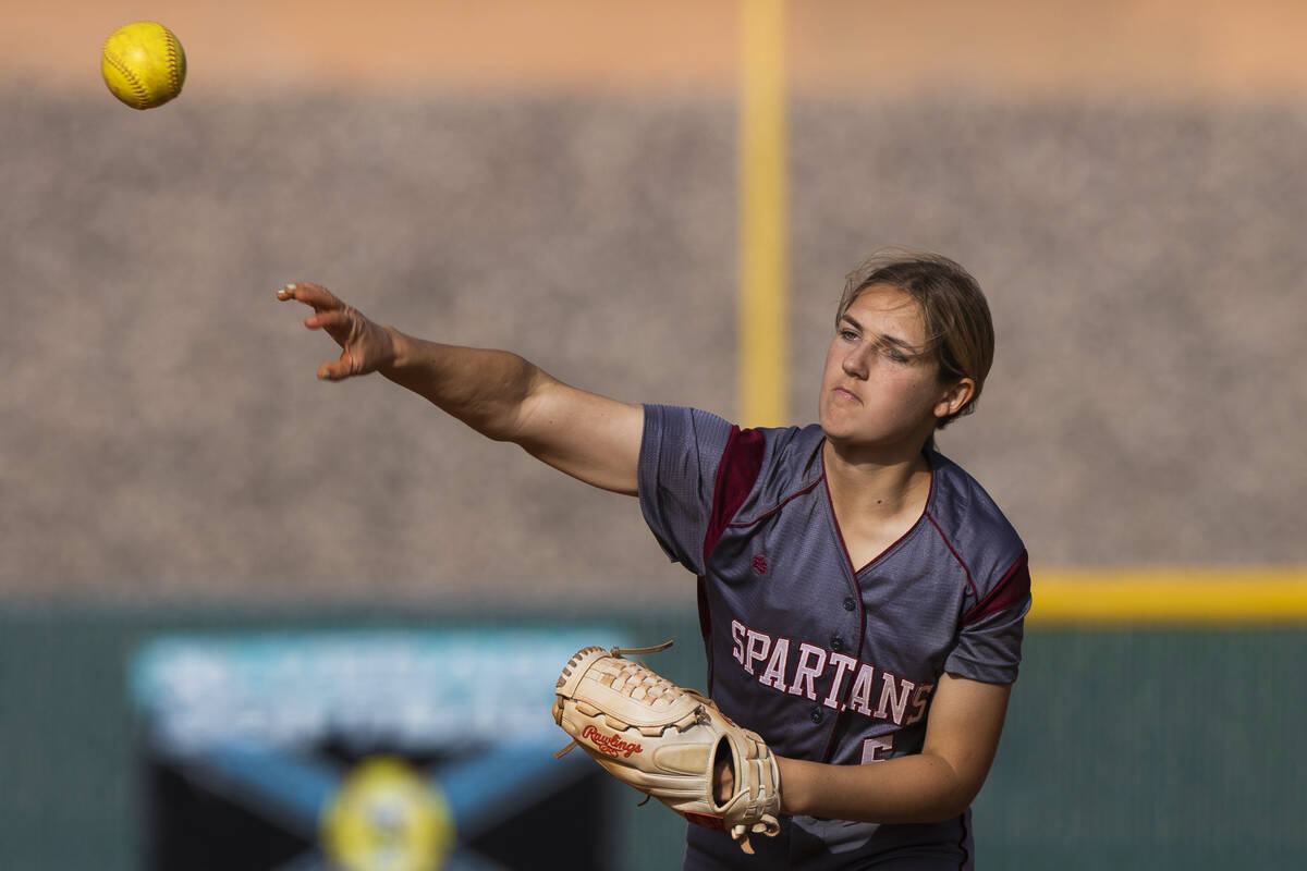 Cimarron-Memorial’s Billie Wile (5) makes a throw to first base during a girls high scho ...