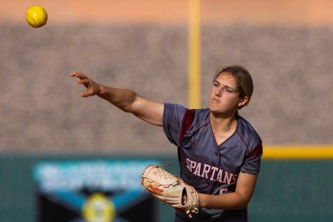Cimarron-Memorial’s Billie Wile (5) makes a throw to first base during a girls high scho ...