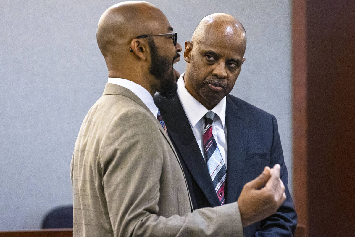 Wendell Melton, right, accused of killing his 14-year-old son in 2017, listens to his attorney ...