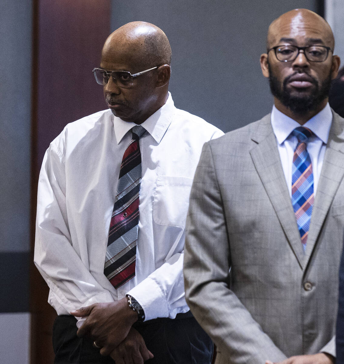 Wendell Melton, left, accused of killing his 14-year-old son in 2017, and his attorneys Jonatha ...
