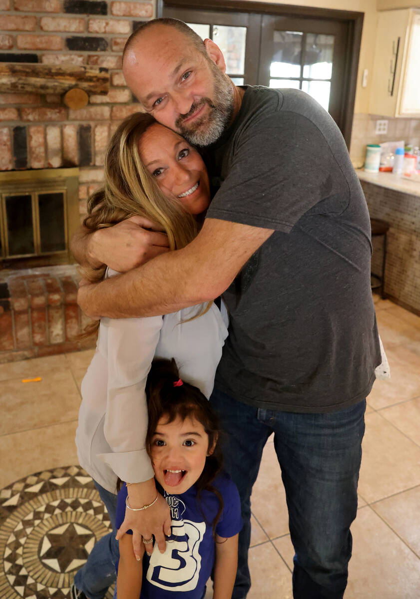 Aimee and Heath Hairr, with their daughter Joselyn Elizabeth Hairr, 3, at their Henderson home ...