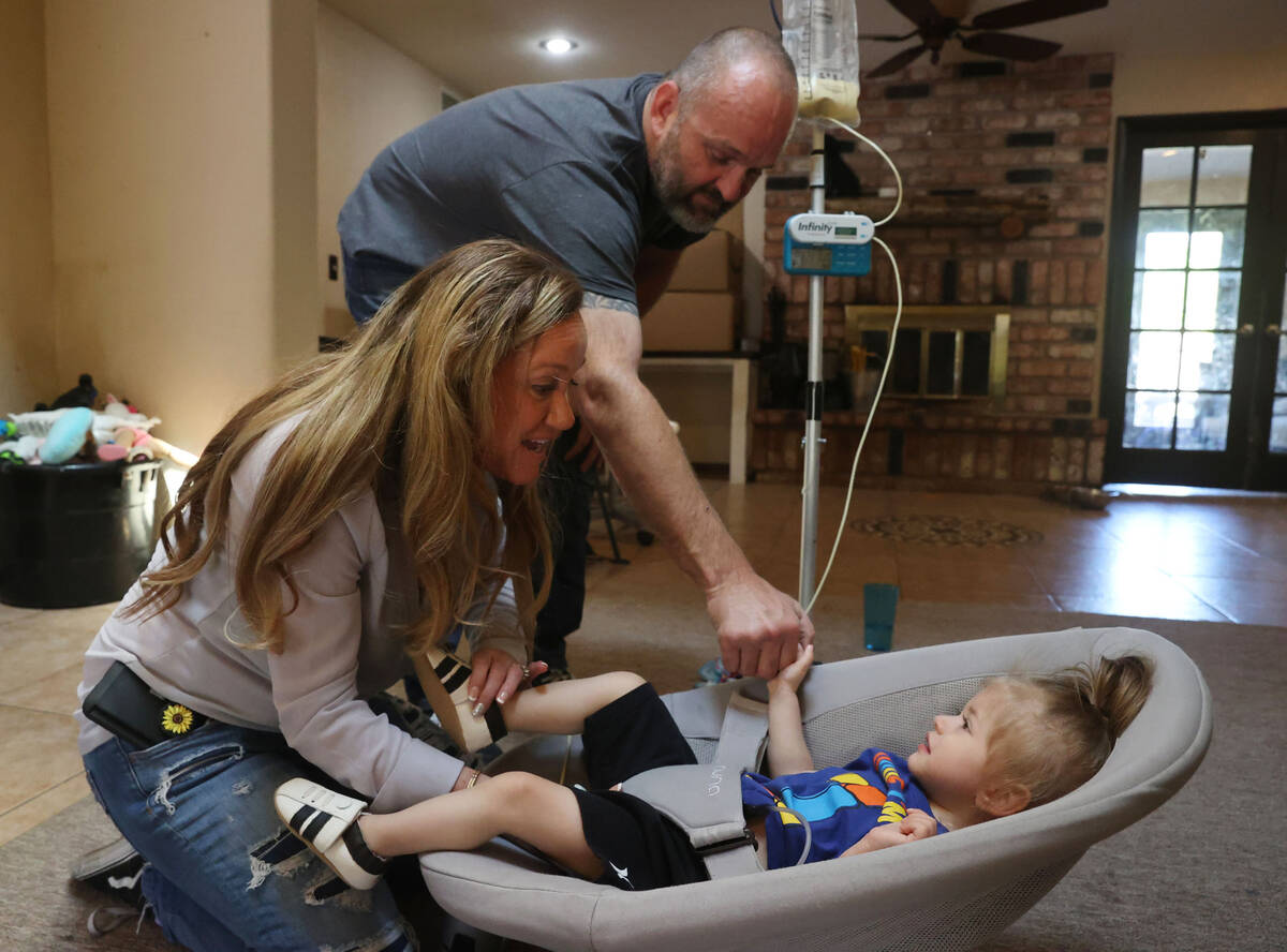 Aimee and Heath Hairr feed Aksel, 1, at their Henderson home Friday, April 22, 2022. The couple ...