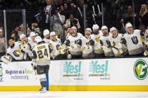 Silver Knights forward Brendan Brisson (24) celebrates with teammates after scoring in the firs ...