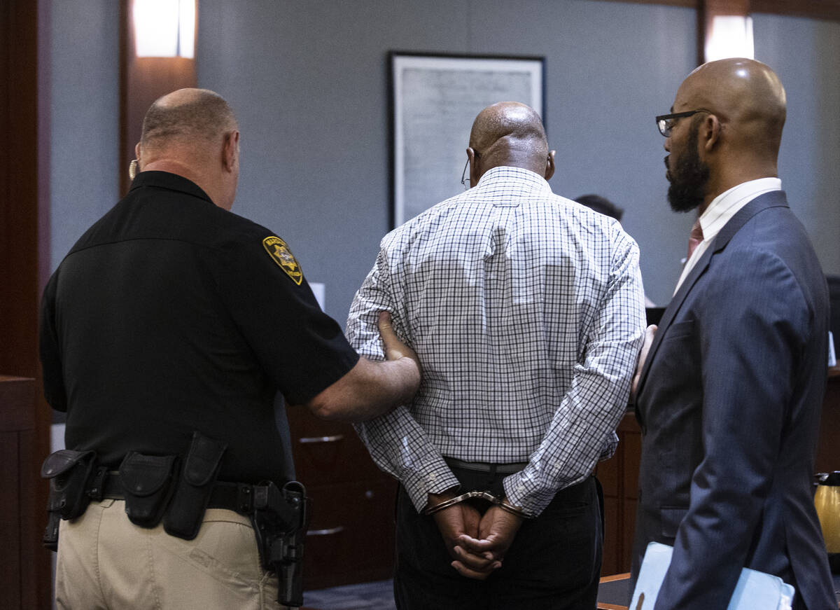 Wendell Melton, center, is comforted by his attorney Jonathan MacArthur, right, as he is led ou ...