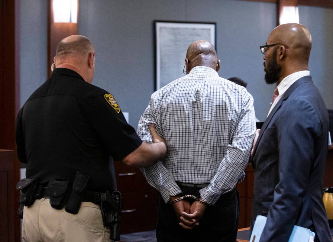 Wendell Melton, center, is comforted by his attorney Jonathan MacArthur, right, on Wednesday, M ...