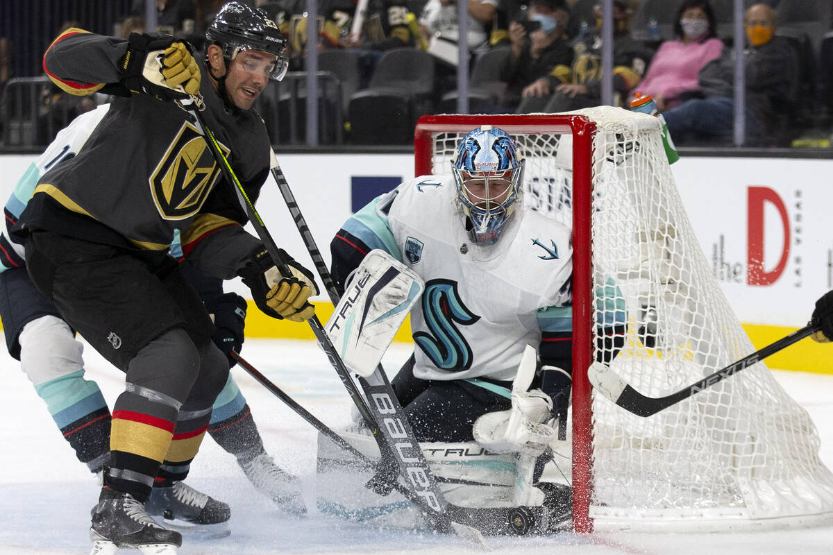 In this Oct. 12, 2021, file photo, Golden Knights defenseman Alec Martinez (23) watches to see ...