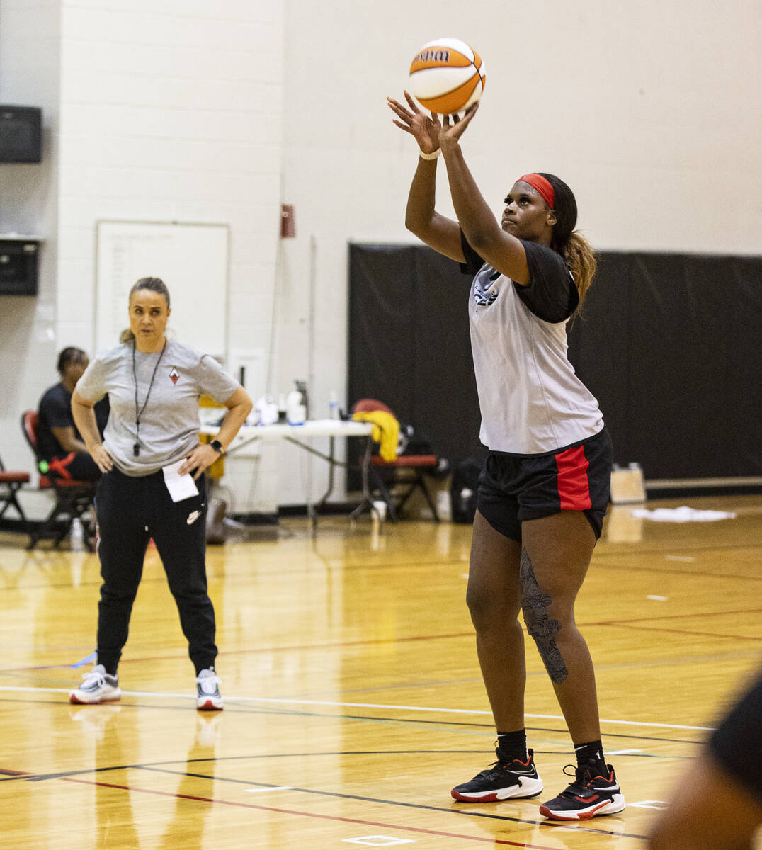 Las Vegas Aces center Kalani Brown prepares to throw the bal]kk as head coach Becky Hammon look ...
