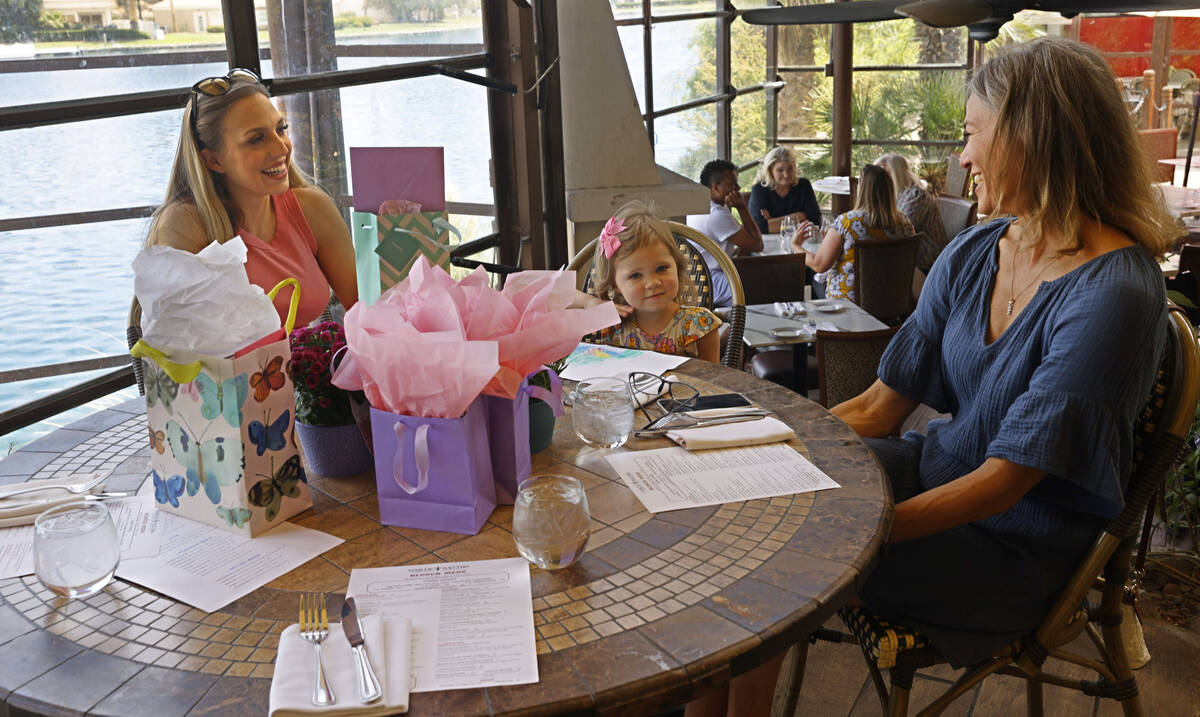 Arianna Pearson, left, talks with her daughter Chanelle, 3, and mother Priscilla Mills, everybo ...