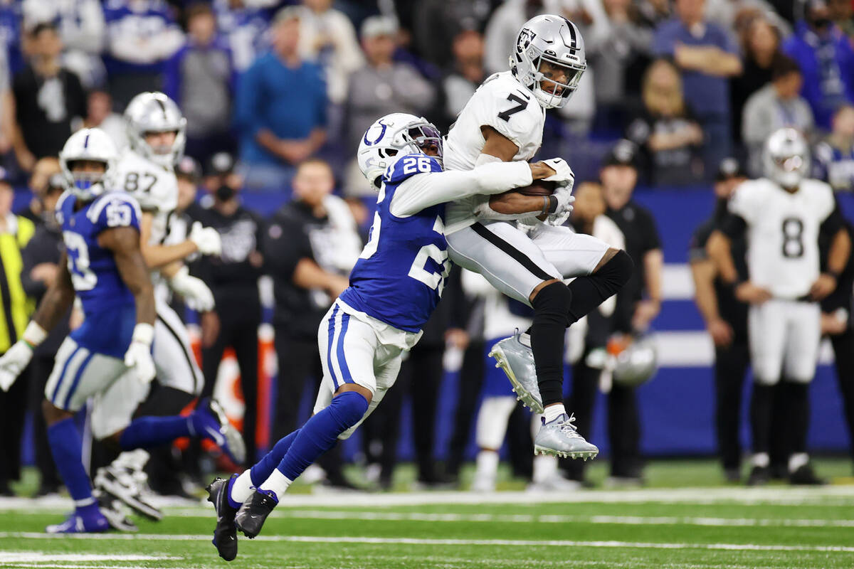 Raiders wide receiver Zay Jones (7) makes a catch as he is tackled by Indianapolis Colts corner ...