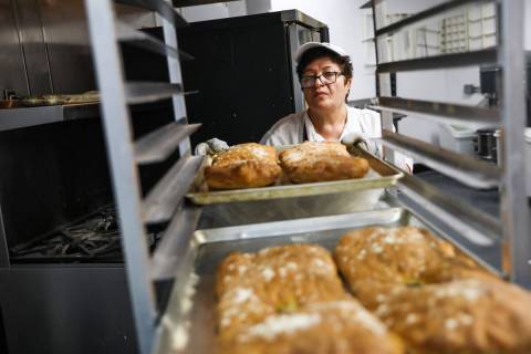 Amahit Abrahamyan sets down freshly baked Armenian bread called puri at Van Bakery in Las Vegas ...