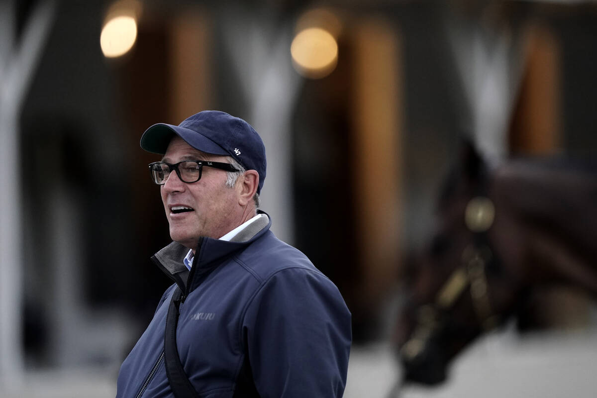 Trainer Tim Yakteen talks to visitors outside his barn at Churchill Downs Wednesday, May 4, 202 ...