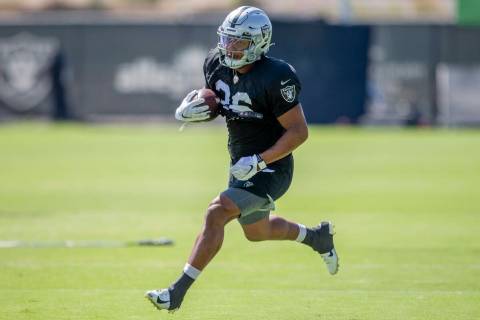 Raiders running back Trey Ragas (36) runs with the football during team practice at the Raiders ...