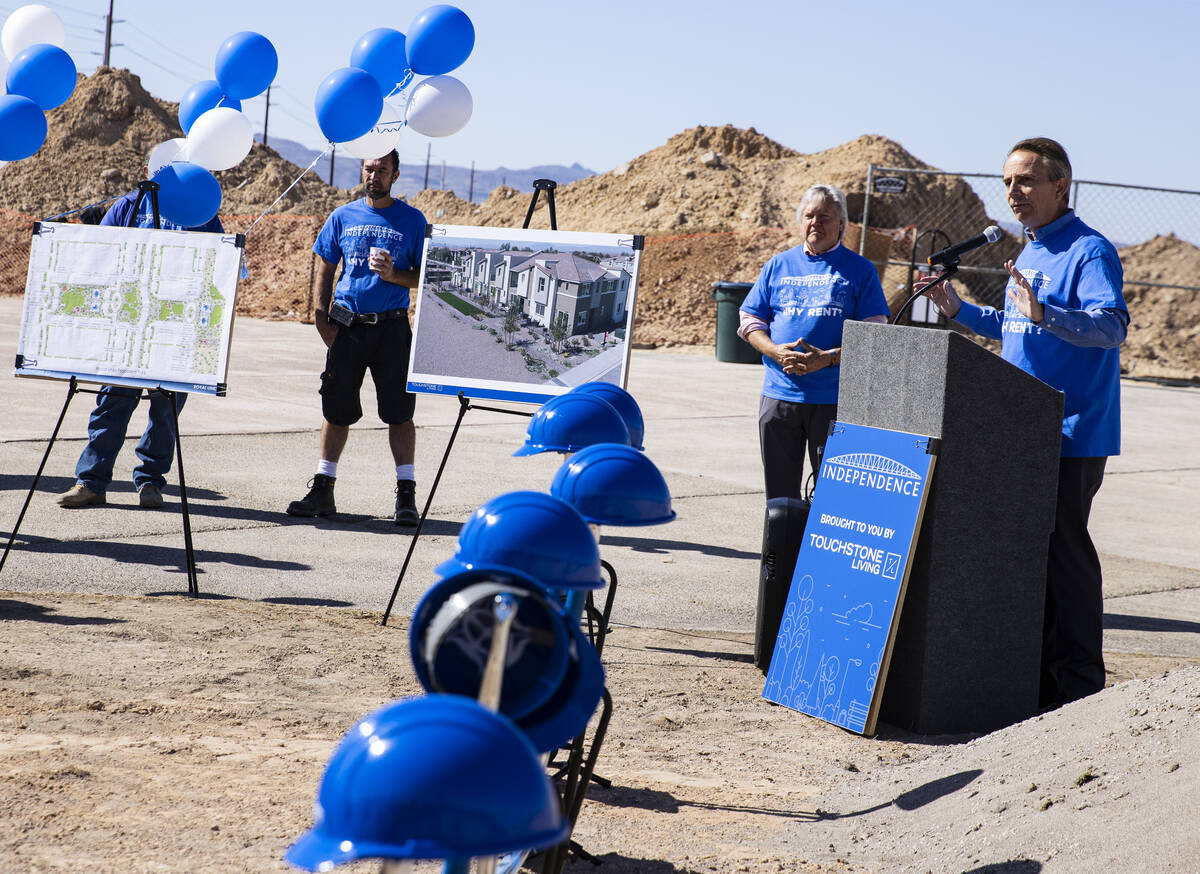 Tom McCormick, right, founder of Touchstone Living, speaks as Commissioner Tick Segerblom, seco ...