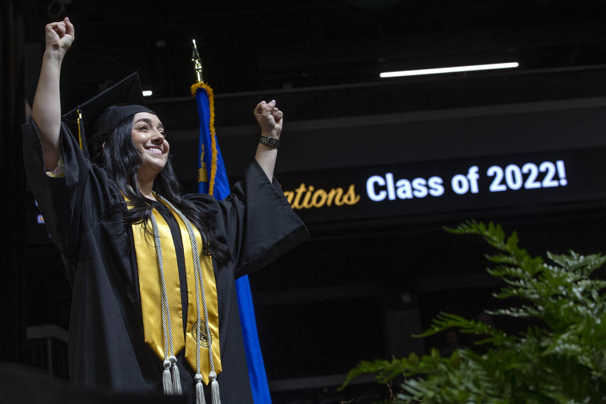 Cristina Paris, who graduated with her Bachelor of Arts in deaf studies, performs the national ...