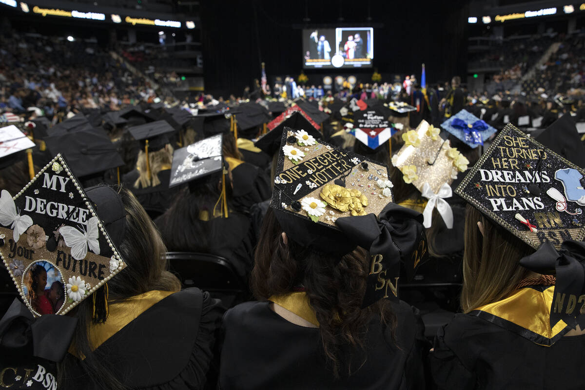 Nursing graduates wear decorated caps during commencement for Nevada State College at Dollar Lo ...