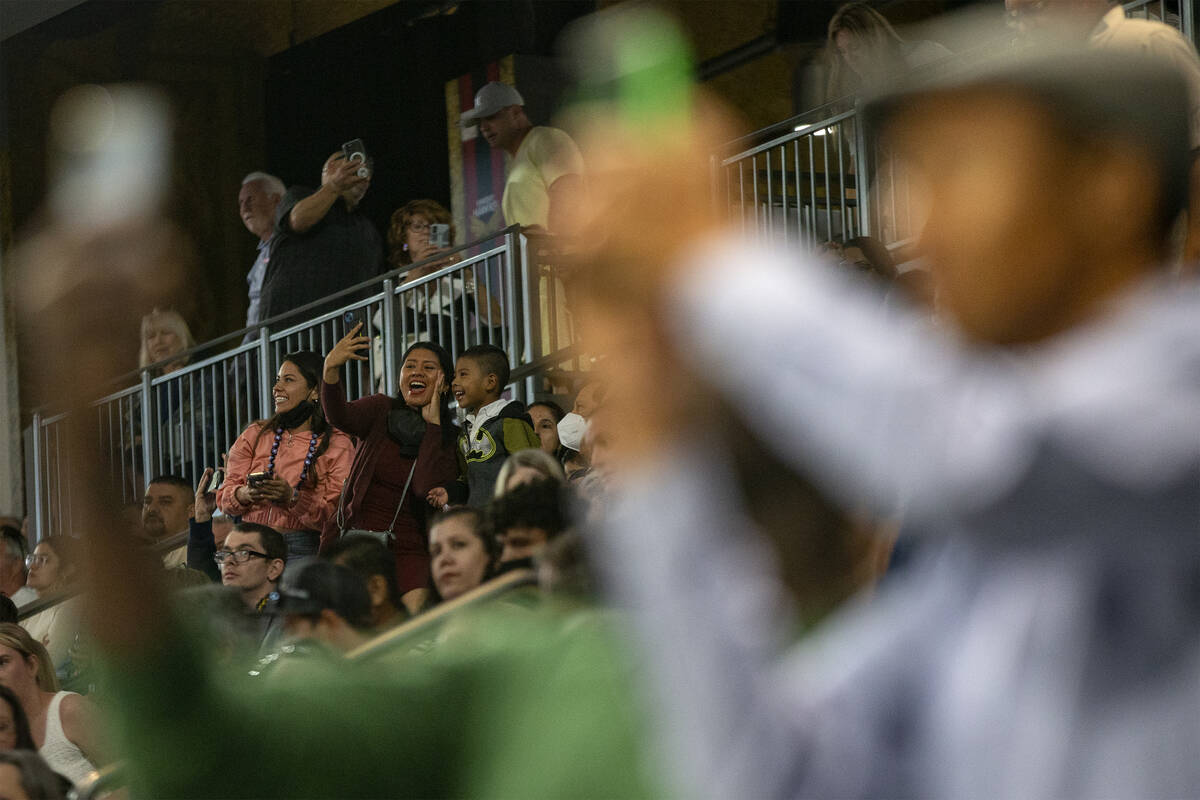 Attendees of commencement for Nevada State College photograph their graduates at Dollar Loan Ce ...