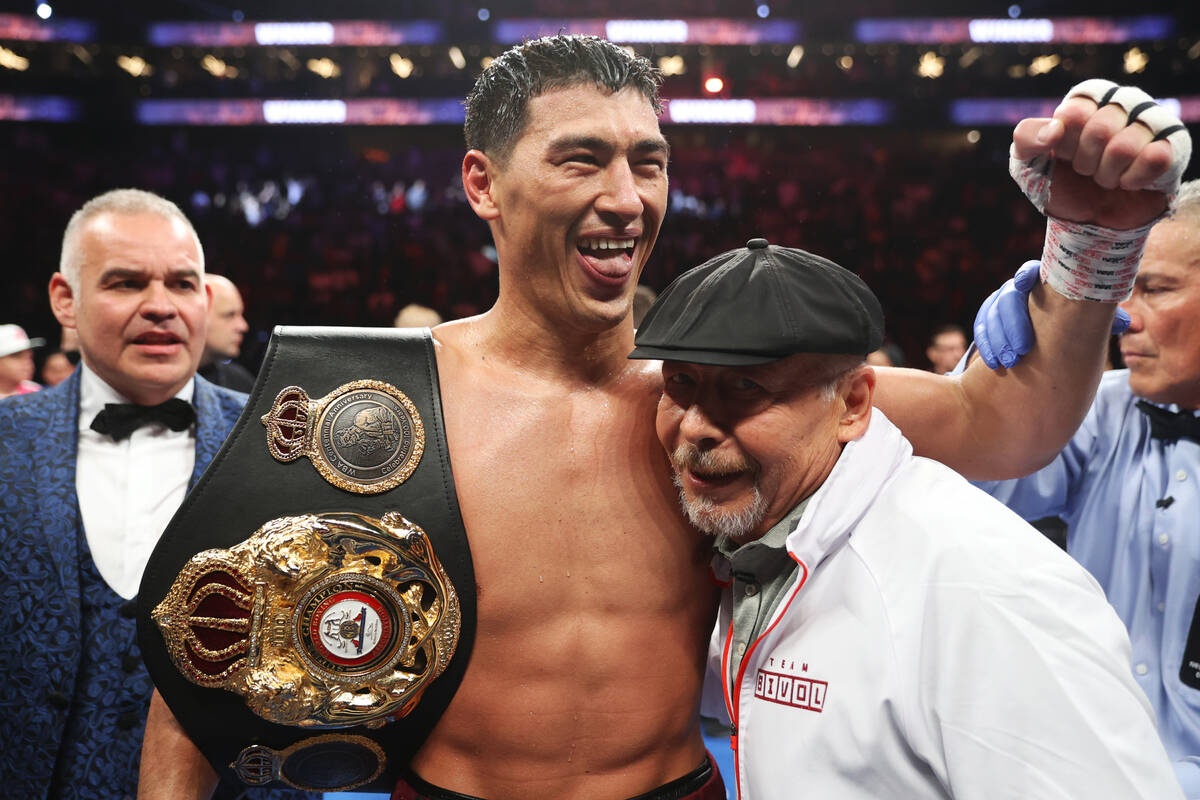 Dmitry Bivol celebrates with his trainer Gennady Mashianov celebrates his win against Saul &#x2 ...