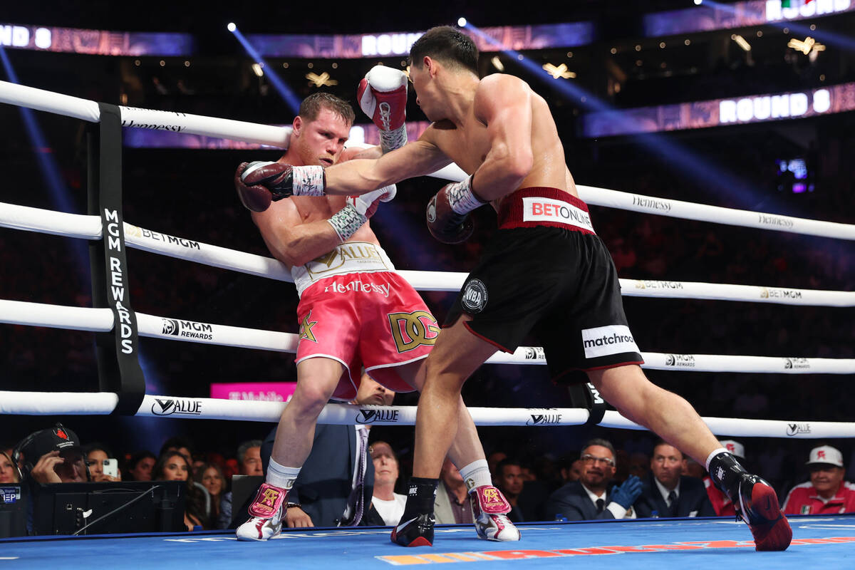 Dmitry Bivol connects a punch against Saul “Canelo” Alvarez in the eight round of ...
