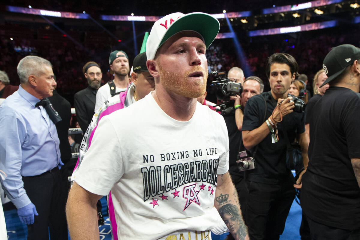 Saul “Canelo” Alvarez leaves the ring after his unanimous decision loss against Dmitry Bivo ...