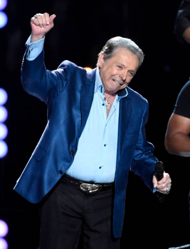 FILE - Mickey Gilley accepts the triple crown award at ACM Presents Superstar Duets at Globe Li ...