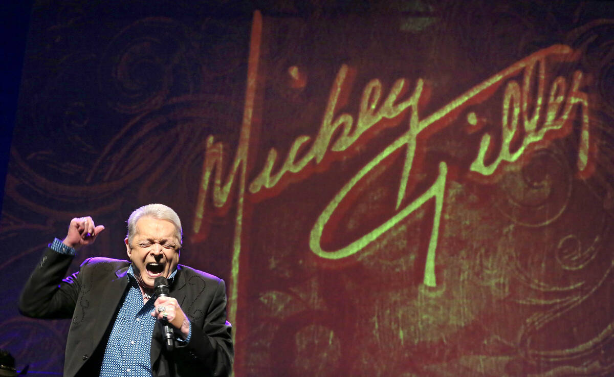 FILE - Country music legend Mickey Gilley, 80, sings the T. Graham Brown hit, "I Tell It L ...