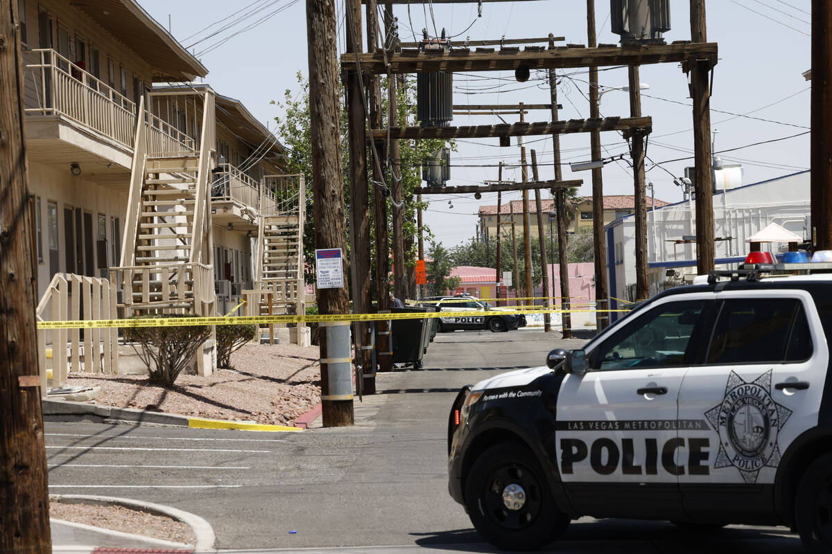 Las Vegas police investigate around the 200 block of South Maryland Parkway, near Russell Road, ...