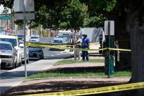 Las Vegas police investigate around the 200 block of Maryland Parkway, near Fremont Street, Sun ...