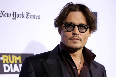 Cast member Johnny Depp arrives at the premiere of "The Rum Diary" in Los Angeles, Th ...