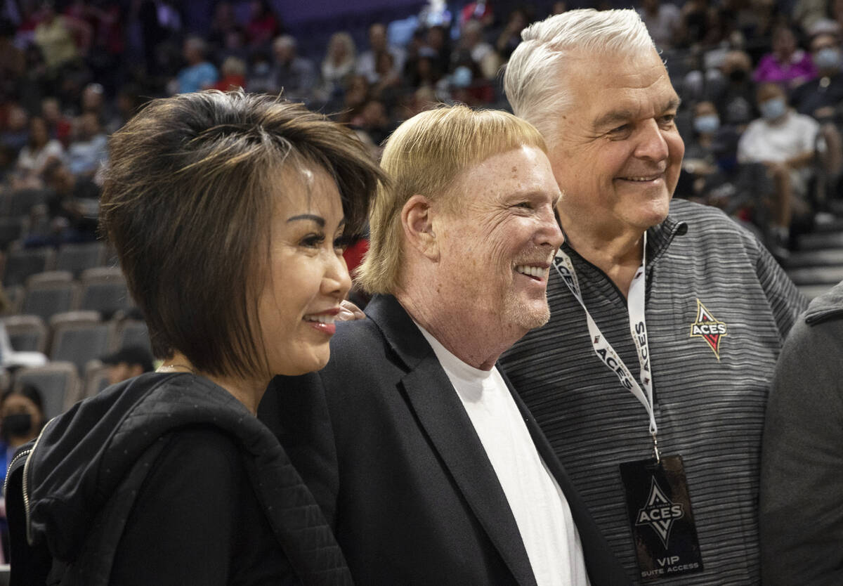 Gov. Steve Sisolak, right, Aces owner Mark Davis and First Lady Kathy Sisolak in the first half ...