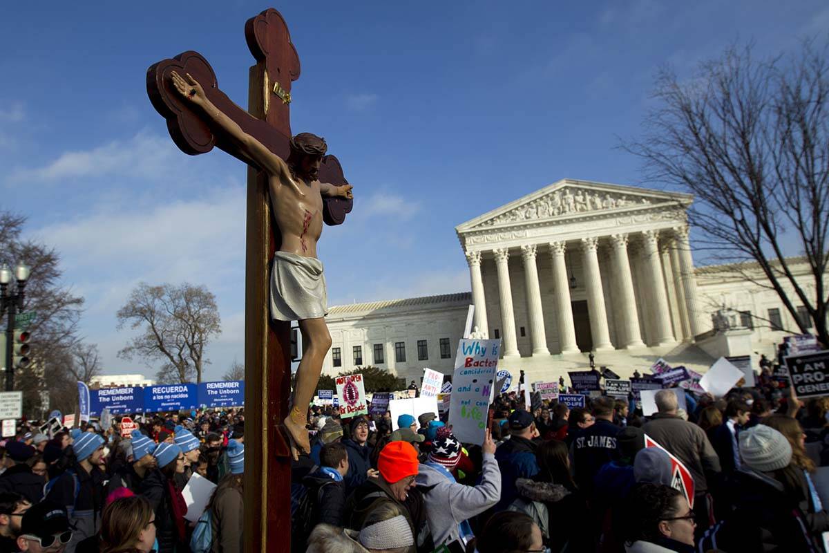 Anti-abortion activists march outside the U.S. Supreme Court building during the March for Life ...