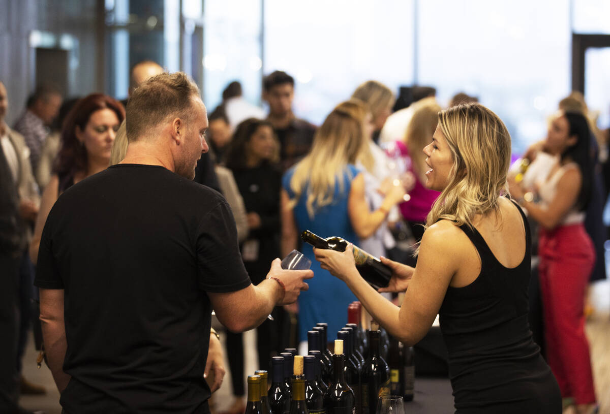 Guests enjoy wine tasting at UNLVino on Saturday, May 7, 2022, at UNLV College of Hospitality, ...