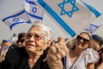 Holocaust survivor Lucy Jacobs, 94, waves an Israeli flag during a celebration of Israel’s in ...