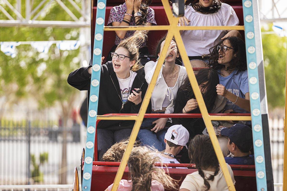 Leedor Boblil, left, enjoys a ride with friends during a celebration of Israel’s independence ...