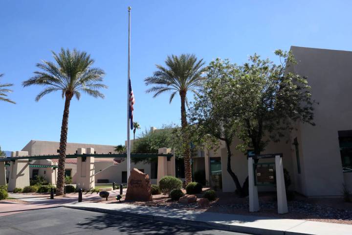 The U.S. and Nevada State flags fly at half mast in front of the Mesquite City Hall on Oct. 6, ...