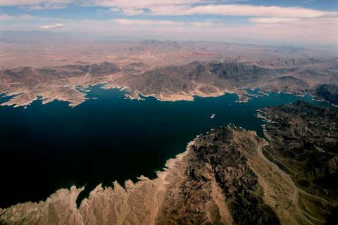 FILE - In this May 1, 2005, photo file, Lake Mead, which separates Arizona, bottom, and Nevada, ...