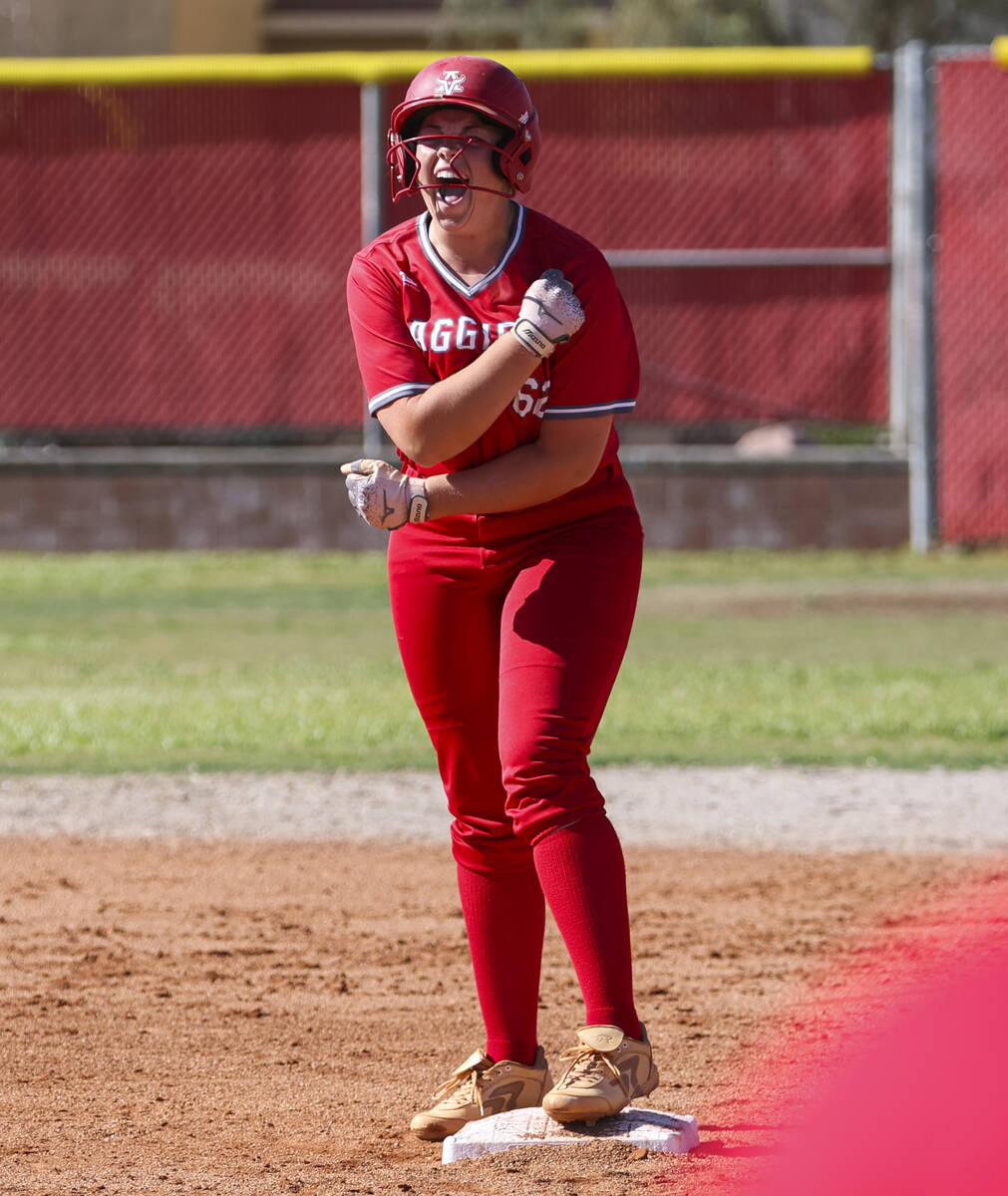 Arbor View's Ashlyn Whipple (62) reacts after a double against Centennial during a softball gam ...