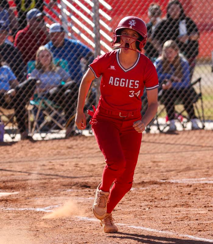 Arbor View's Makena Strong (34) celebrates after her hit against Centennial during a softball g ...