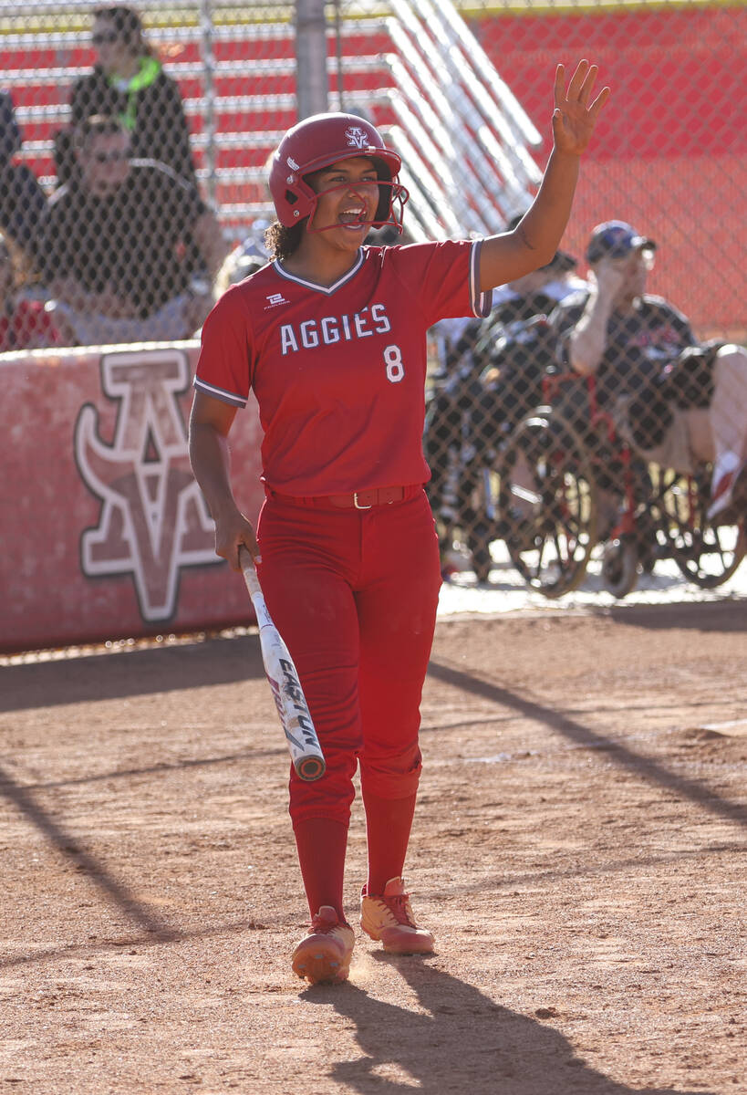 Arbor View's Trinity Brandon (8) reacts after scoring a run against Centennial during a softbal ...