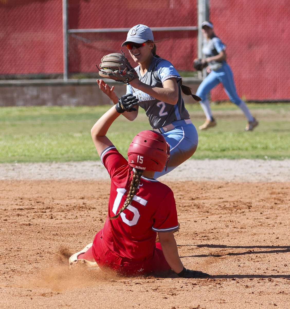 Arbor View's Paige Kellogg (15) gets tagged out at second base by Centennial's Juliana Bosco (2 ...