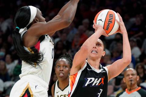 Phoenix Mercury's Diana Taurasi (3) shoots as Las Vegas Aces' Jackie Young (0) defends during t ...