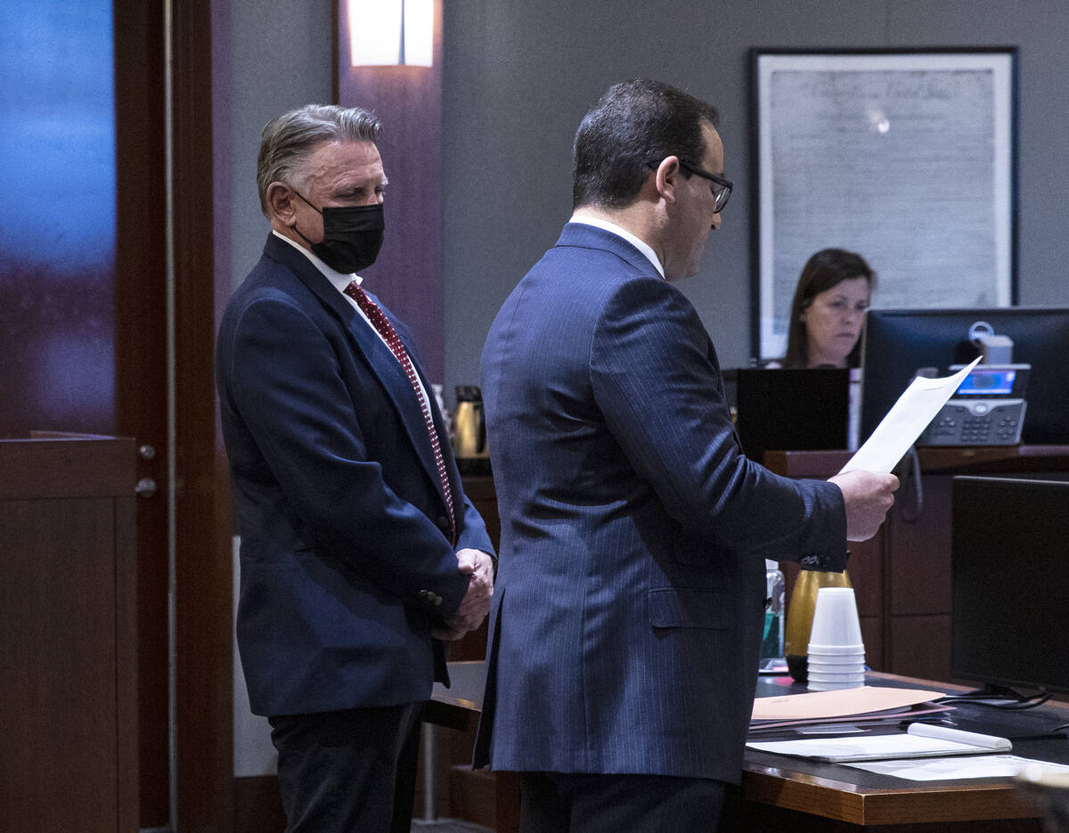 Gregory "Brent" Dennis, left, listens as his attorney Richard Schonfeld addresses the court dur ...