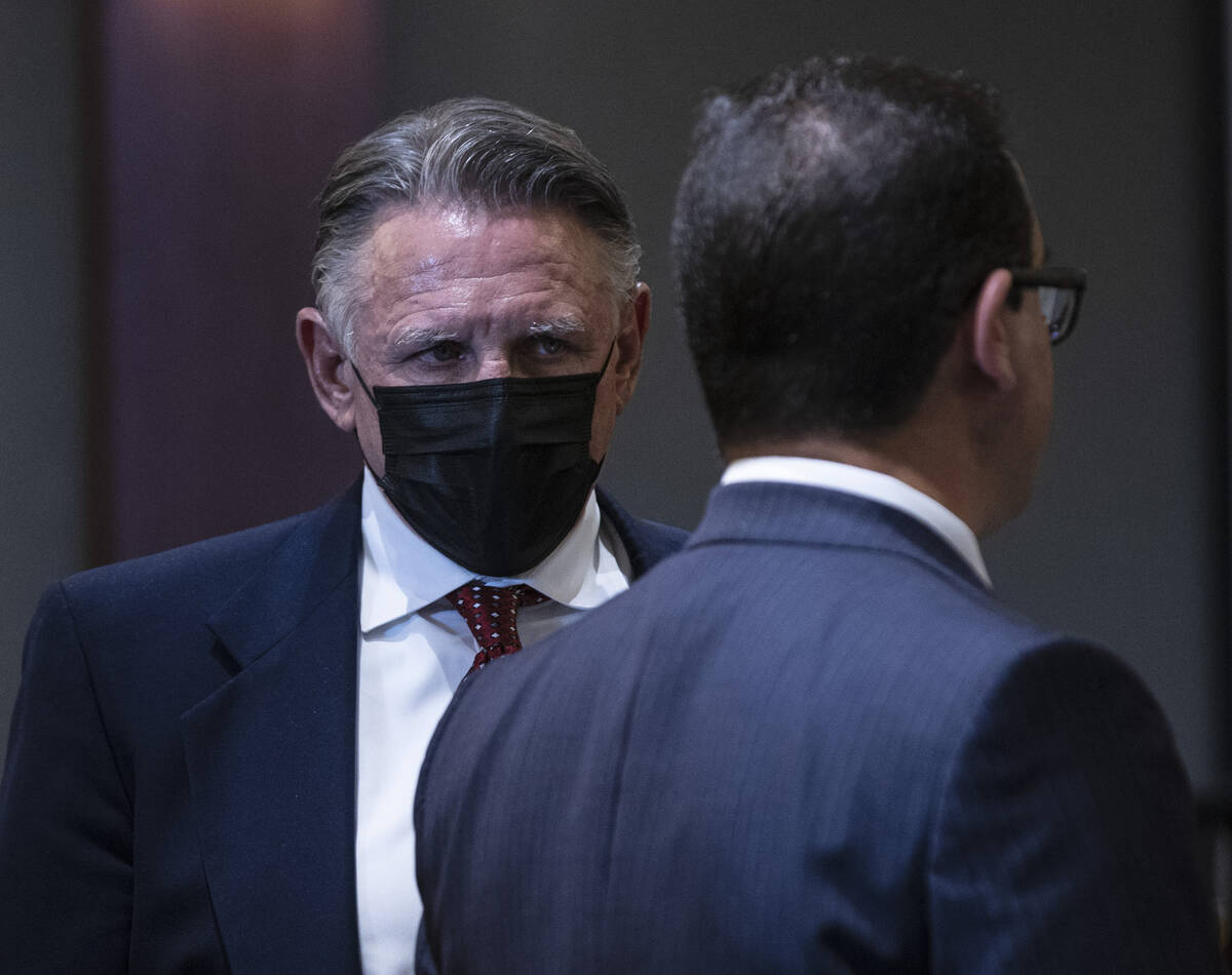 Gregory "Brent" Dennis, left, listens to his attorney Richard Schonfeld during his sentencing a ...