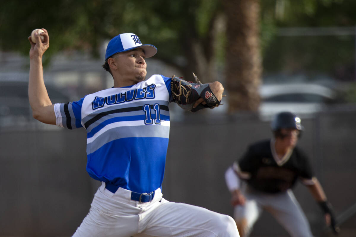 Basic pitcher Aaron Rubio (11) throws to Faith Lutheran during a Class 5A Southern Region high ...
