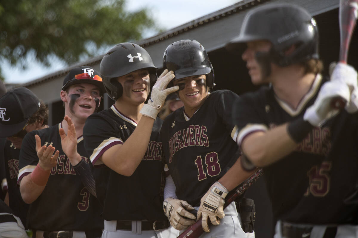 Faith Lutheran players including Joseph Schimick (3), Michael Albanese (5) and Benjamin Loverin ...