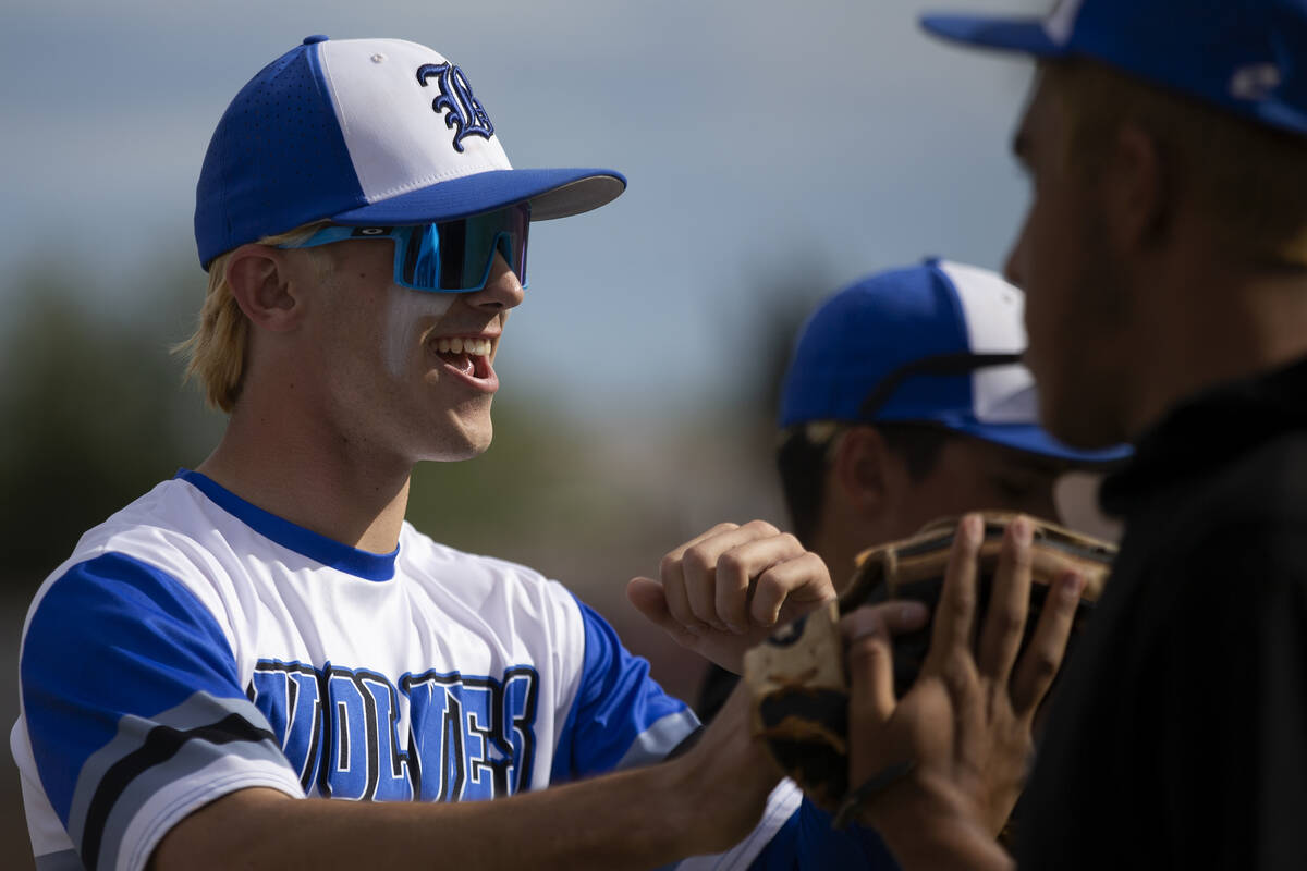 Basic outfielder Colin Hushaw (15) is congratulated after making an out during a Class 5A South ...