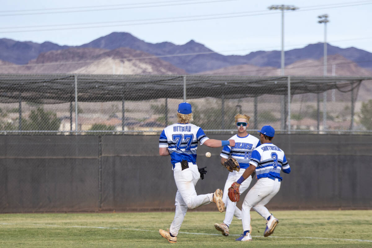 Basic players Chase Ditmar (77), Colin Hushaw (15) and Ty Southisene (3) run for a foul ball hi ...